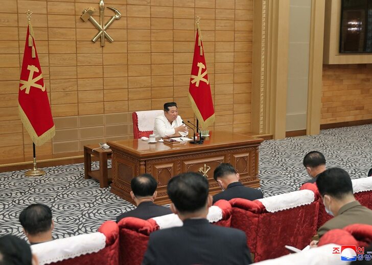 North Korean leader Kim Jong Un speaks at a politburo meeting of the Worker's Party on the country's coronavirus disease (COVID-19) outbreak response in Pyongyang