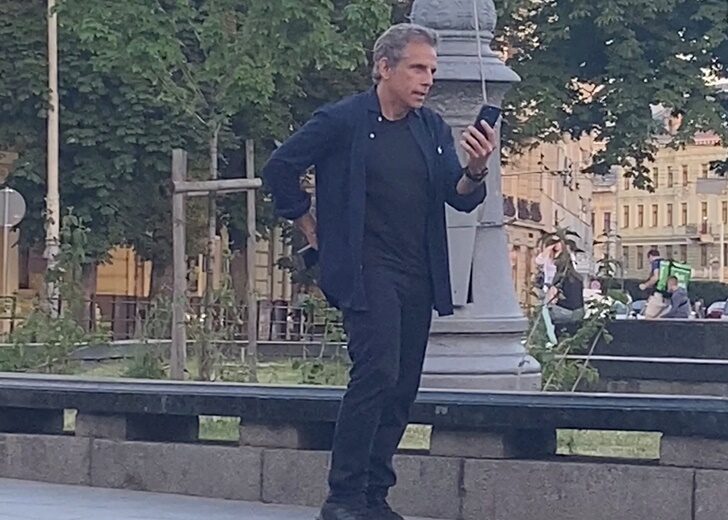 Actor Ben Stiller speaks on a phone while walking in Lviv