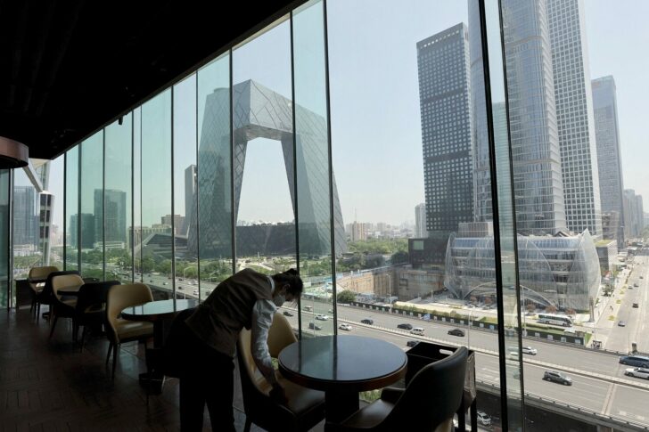 FILE PHOTO: Staff member at a restaurant in Beijing's Central Business District