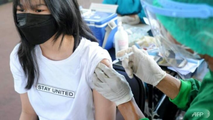 a-young-woman-receives-the-astrazeneca-covid-19-coronavirus-vaccine-at-a-makeshift-mass-vaccination-clinic-on-indonesia-s-resort-island-of-bali-1625583303018-2_0