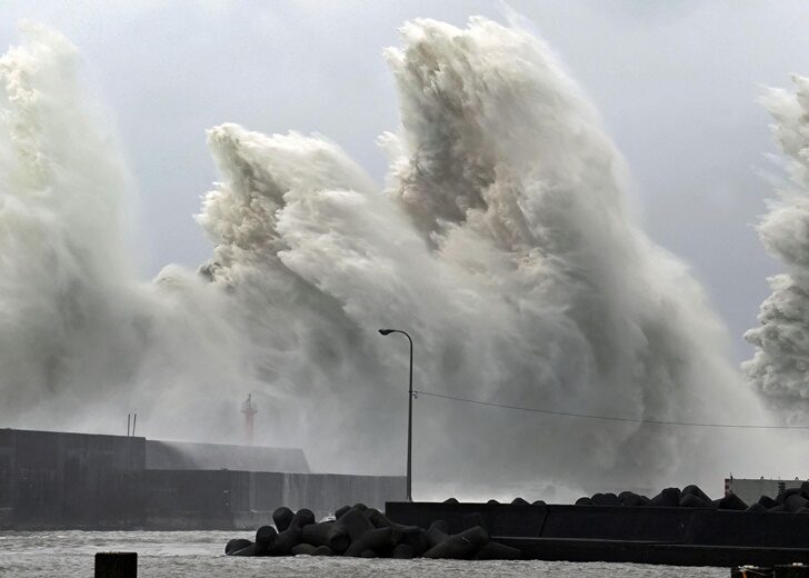 High waves triggered by Typhoon Nanmadol are seen at a fishing port in Aki
