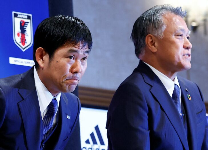 Japanese national soccer team's head coach Hajime Moriyasu and Japan Football Association President Kozo Tashima greet attendees after a news conference to name the squad for the 2022 Qatar World Cup, in Tokyo