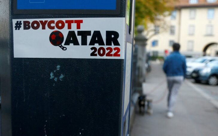 A sticker against the FIFA World Cup Qatar 2022 is seen on a parking meter in Zurich