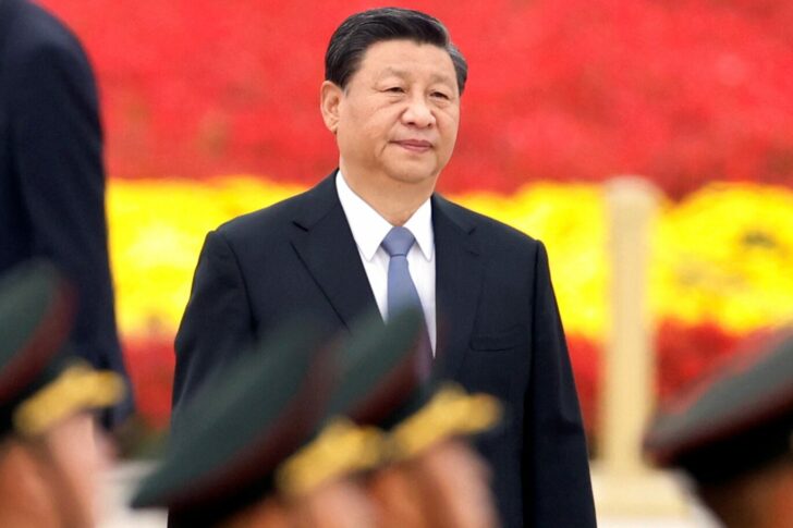Chinese President Xi Jinping arrives for a ceremony at the Monument to the People's Heroes on Tiananmen Square to mark Martyrs' Day in Beijing