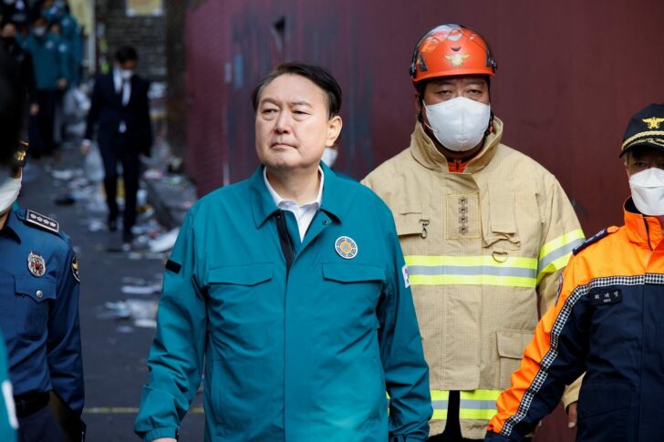 South Korean President Yoon Suk-yeol walks at the scene where many people died and were injured in a stampede during a Halloween festival in Seoul