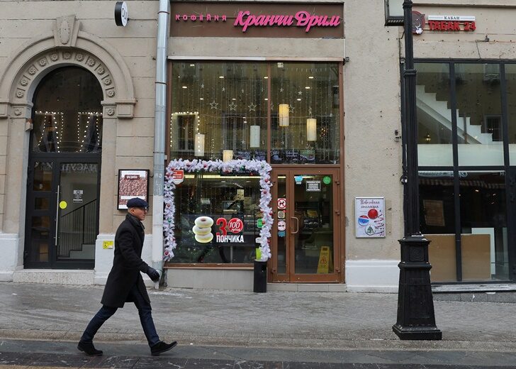 A man walks past the Krunchy Dream cafe in Moscow