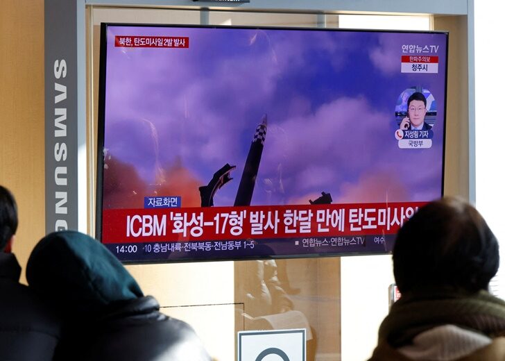 People watch a TV broadcasting a news report on North Korea firing a ballistic missile off its east coast, in Seoul