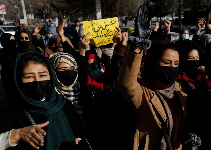 Afghan women chant slogans in protest against the closure of universities to women by the Taliban in Kabul