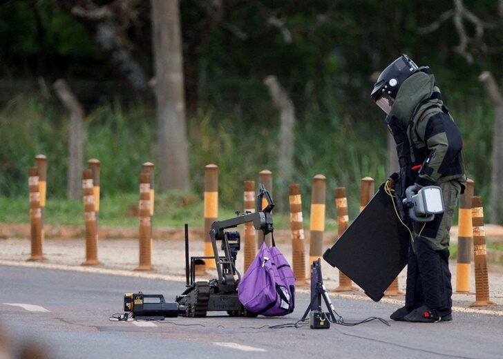 A robot of the federal police bomb squad is seen near what is believed to be an explosive artifact in Brasilia, Brazil