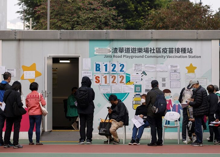 People queue at a community vaccination centre, ahead of an expected border reopening with China, during the coronavirus disease (COVID-19) pandemic in Hong Kong