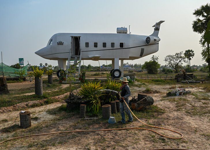 CAMBODIA-HOUSE-AIRPLANE-OFFBEAT
