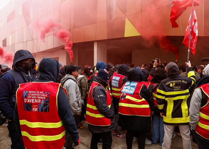 Striking workers cut power to the large sports arena Stade de France and the Olympic village near Paris