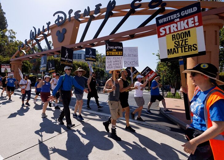 FILE PHOTO: Hollywood actors and writers on strike outside Disney studios in California