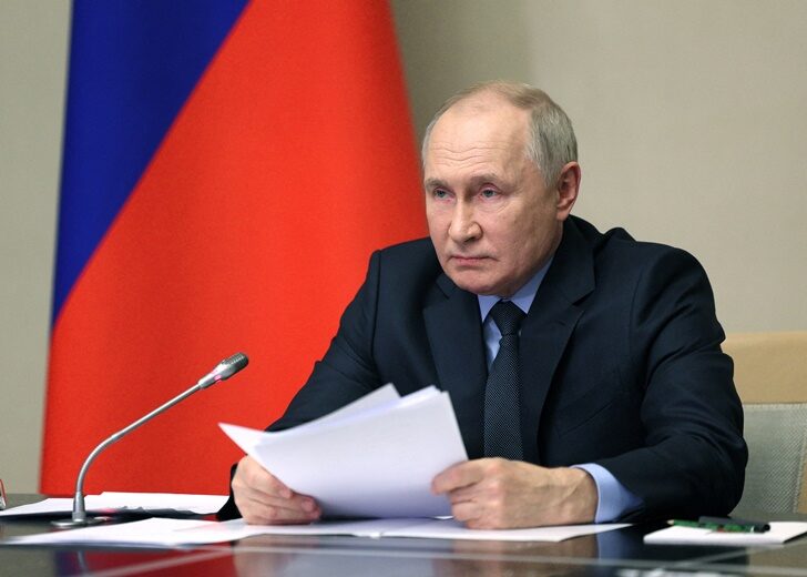 Russian President Vladimir Putin chairs a meeting of members of his Security Council and the government and the heads of law enforcement agencies, outside Moscow