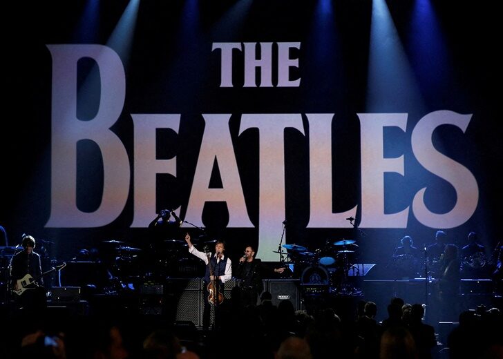 FILE PHOTO: Paul McCartney and Ringo Starr perform during the taping of