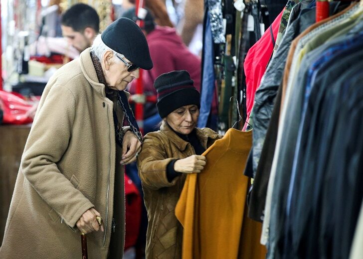 FILE PHOTO: People shop in a used clothing shop in Buenos Aires
