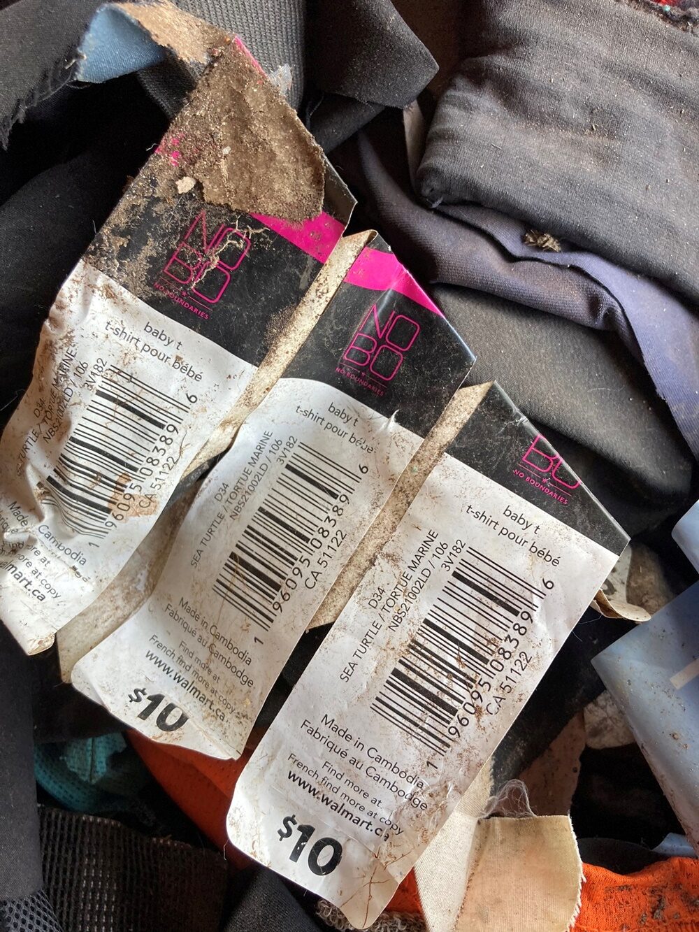 Waste from international clothing brands is stored before being used to fuel kilns at a brick factory on the outskirts of Phnom Penh