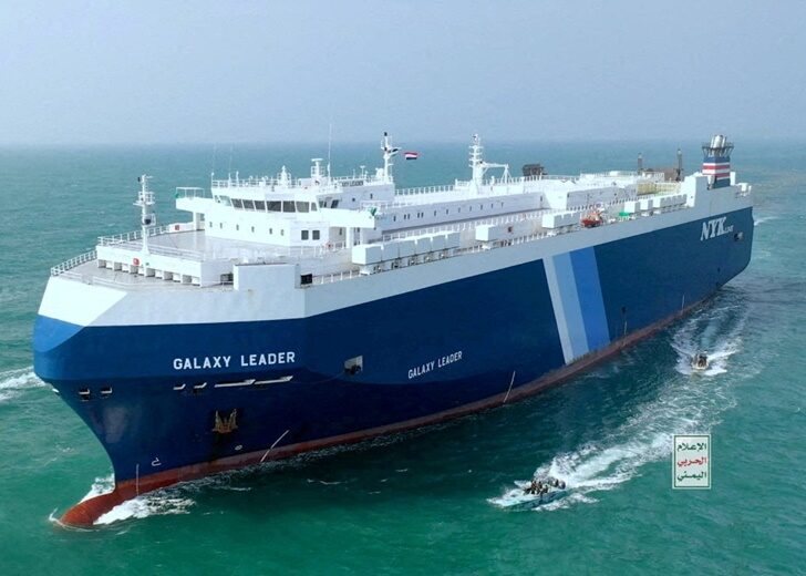 FILE PHOTO: The Galaxy Leader cargo ship is escorted by Houthi boats in the Red Sea
