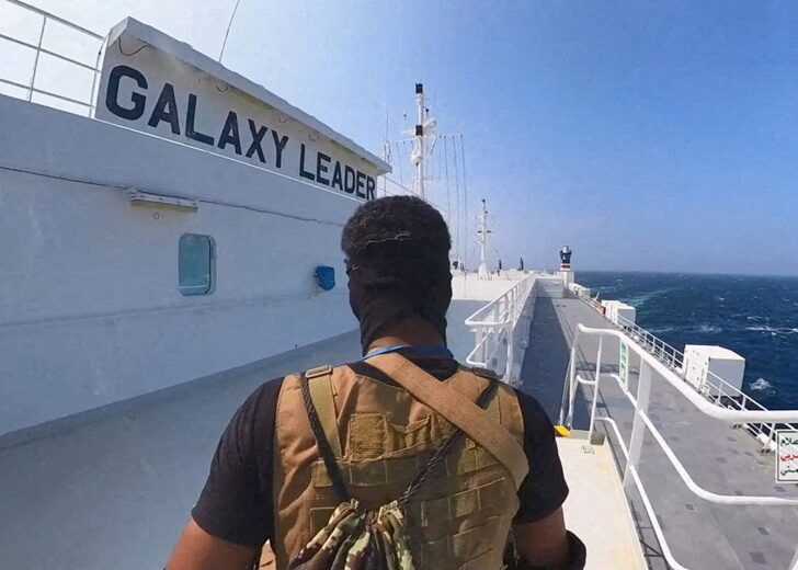 FILE PHOTO: Houthi fighter stands on the Galaxy Leader cargo ship in the Red Sea