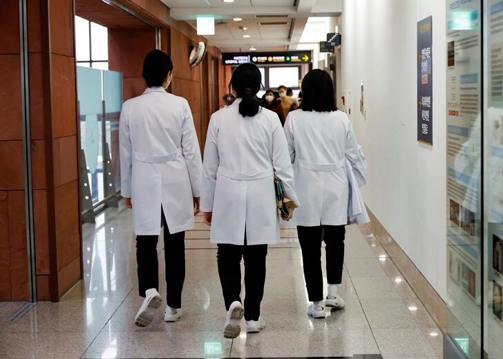 Medical workers walk at Severance Hospital in Seoul