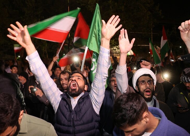 Iranians react after the IRGC attack on Israel, in Tehran