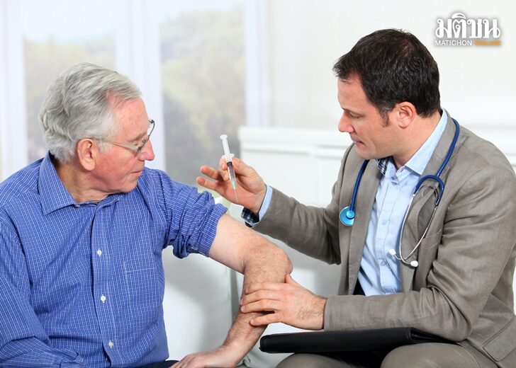 Doctor doing vaccination to elderly man