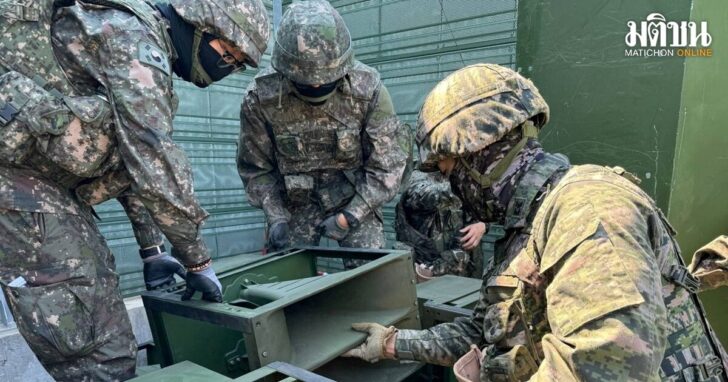 FILE PHOTO: South Korean soldiers work on a loudspeaker that is set up for propaganda broadcasts during a military drill near the demilitarized zone separating the two Koreas in Paju