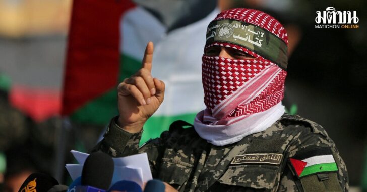 FILE PHOTO: Abu Ubaida, the spokesman of the Izz el-Deen al-Qassam Brigades, gestures as he speaks during an anti-Israel military show in the southern Gaza Strip