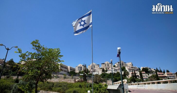 FILE PHOTO: The Israeli national flag flutters as apartments are seen in the background in the Israeli settlement of Maale Adumim in the Israeli-occupied West Bank