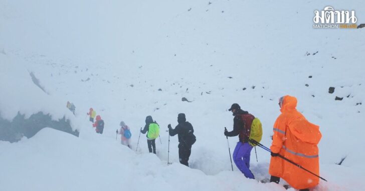 A screen capture from video shows trekkers leaving their campsite, as unusually heavy snow and rainfall pummeled the Himalayas, in the Tibet Region