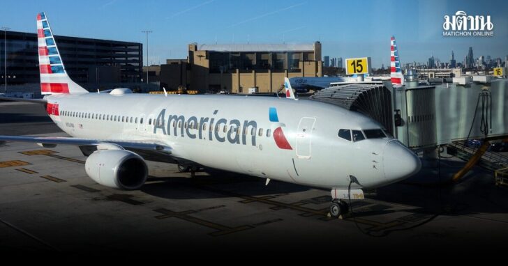 FILE PHOTO: An American Airlines plane is parked at a gate at LaGuardia Airport in New York City