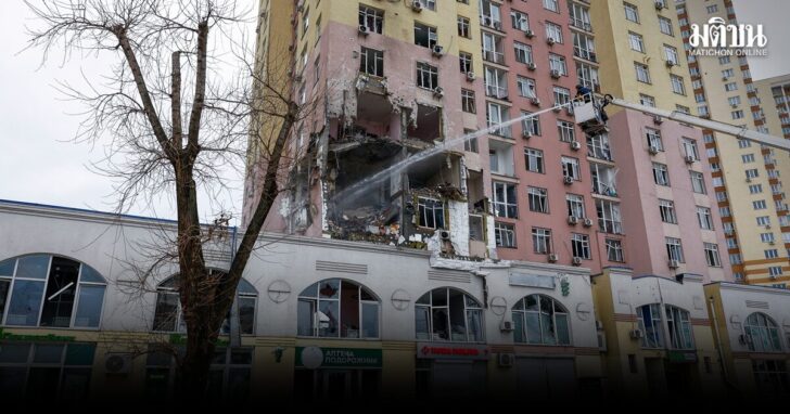 Firefighters work at the site of an apartment building hit during Russian missile and drone strikes, amid Russia’s attack on Ukraine in Kyiv,