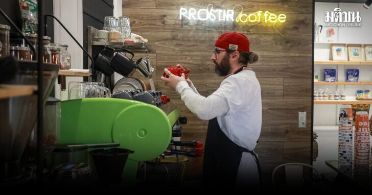 Cafe manager Melnychenko prepares coffee in his cafe in Kherson