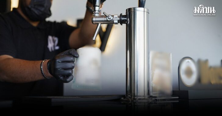 An employee pours a draft non-alcoholic beer at the A12 cafe in Riyadh