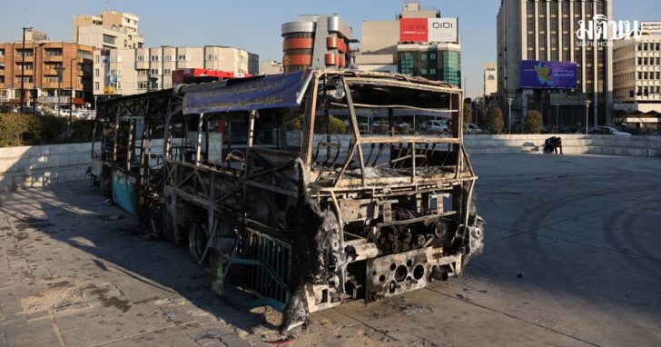 Bus burned during Iranian protests, on a street in Tehran