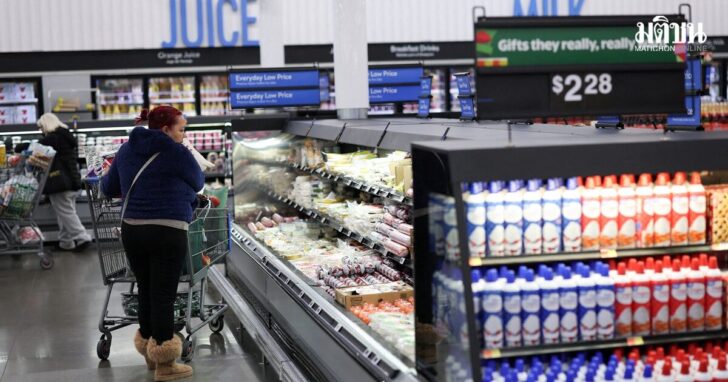 FILE PHOTO: Customers shop for groceries at Walmart Supercenter retail store in North Bergen, New Jersey