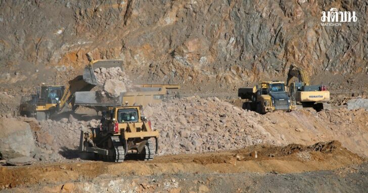 FILE PHOTO: Wheel loaders fill trucks with ore at the MP Materials rare earth mine in Mountain Pass