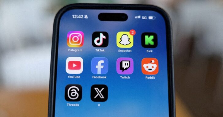 FILE PHOTO: Social media applications are displayed on a mobile phone in this picture illustration