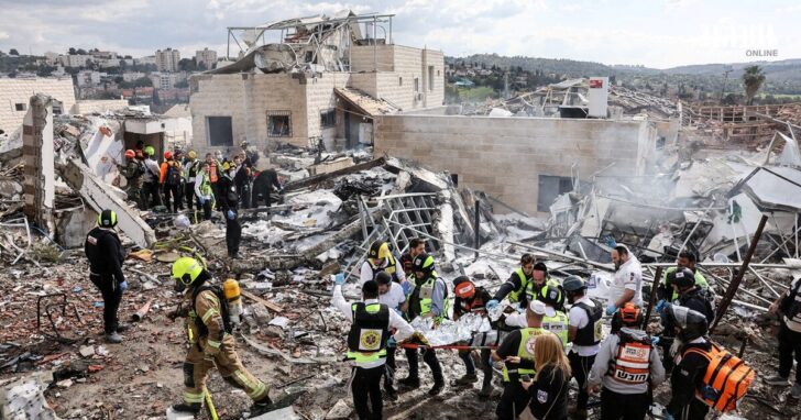 Emergency response teams attend the scene of a fatal Iranian strike, after Iran launched missile barrages following attacks by the U.S. and Israel on Saturday, in Beit Shemesh