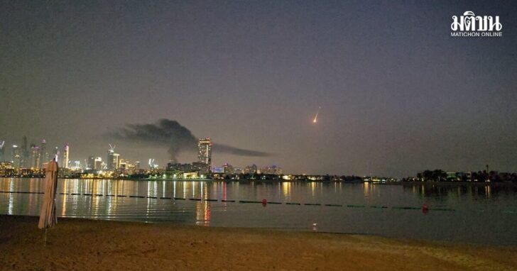 Smoke rises over a hotel damaged in Dubai's famed Palm Jumeirah, in Dubai