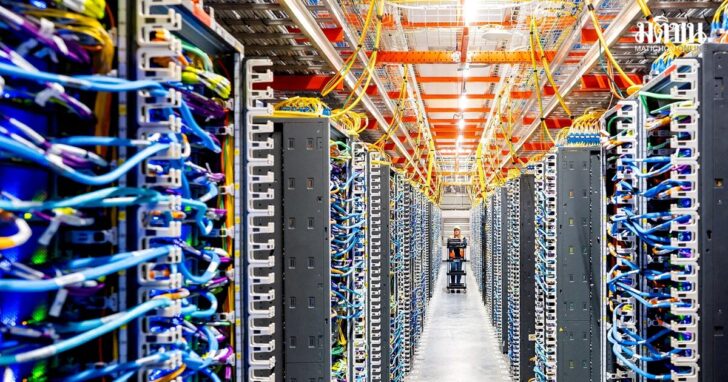 FILE PHOTO: A technician works at an Amazon Web Services AI data center in New Carlisle