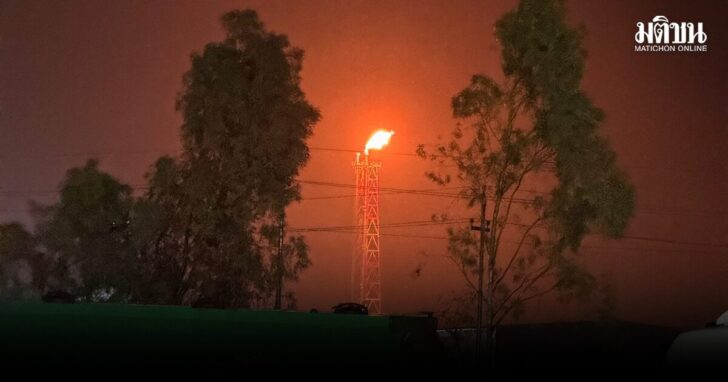 A gas flare burns at the Lanaz refinery after it was targeted by a drone strike, in Erbil