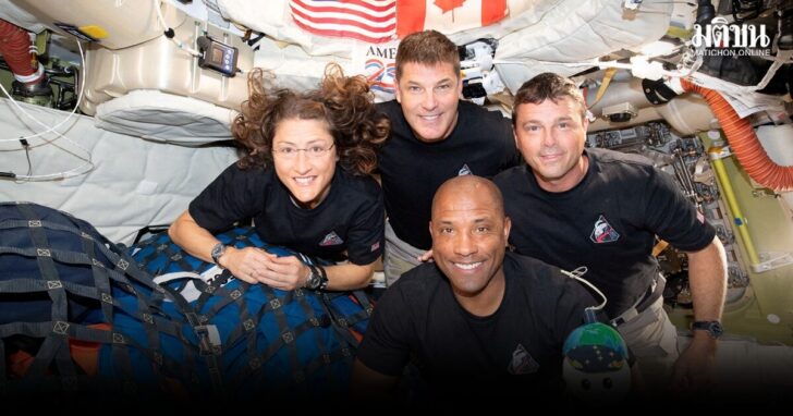 The NASA Artemis II crew pose for a photo