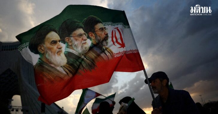 FILE PHOTO: A man holds a flag during a rally in Tehran
