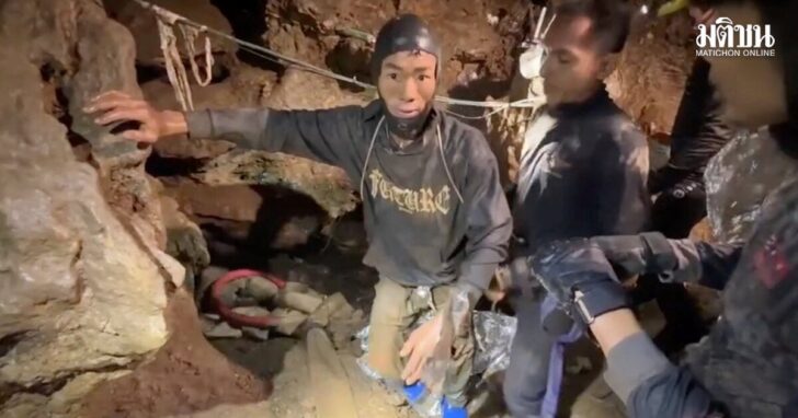 Rescuers pull out the first trapped person named Mued from a flooded cave in Xaisomboun Province