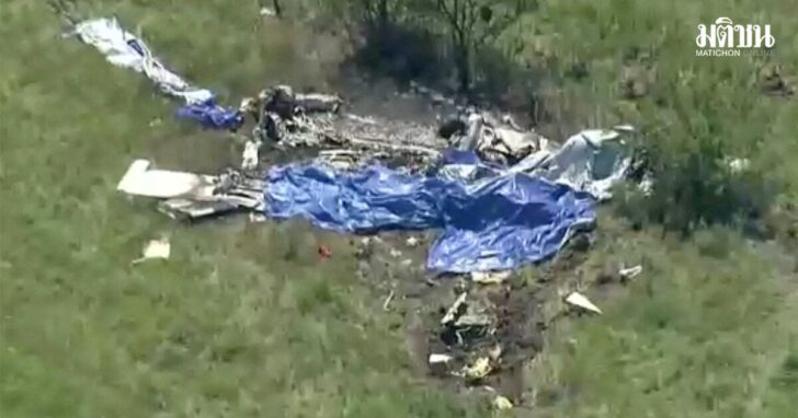Wreckage lies in a field next to Butler Memorial Airport after a plane carrying skydivers crashed