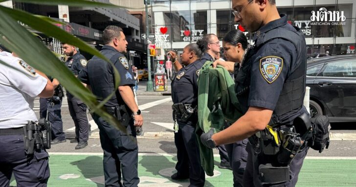 New York Police Department officers gather after alleged gunfire was heard in Times Square, in New York City