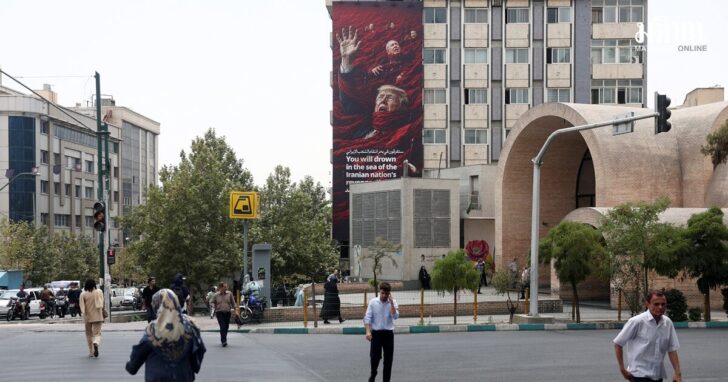 A billboard depicting U.S. President Trump and Israeli Prime Minister Netanyahu, on a building in Tehran