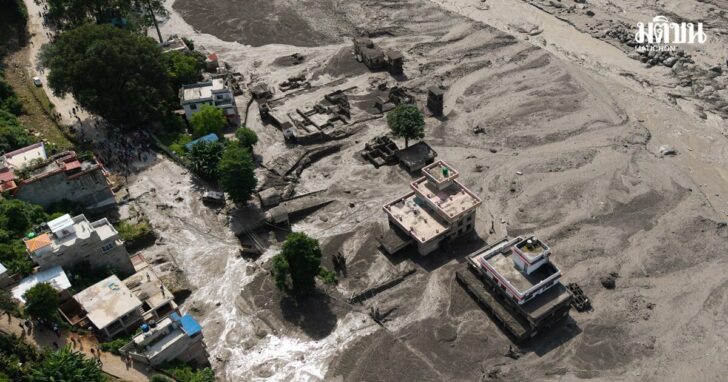 A drone view shows mud covering properties following a flash flood at Trishuli, Nepal