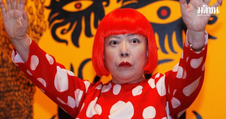 FILE PHOTO: Artist Yayoi Kusama poses for a photograph with a detail from her artwork